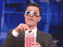 popcorn-stephencolbert.gif.f323f5cb8d747ef521a60386ddb8d787.gif