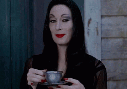 smiles-morticia.gif.99d5d0e9a45f17d76d9f389ecf28d9b8.gif